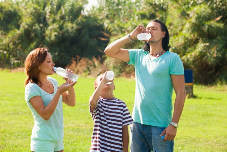 Military family drinking water to stay hydrated